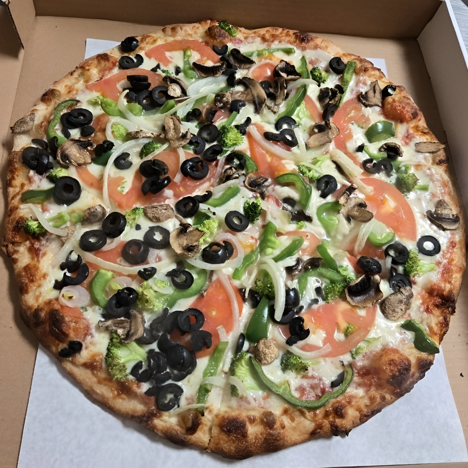 Checkers Pizza's veggie pizza, topped with black olives, green peppers, onions, tomatoes, broccoli, and mushrooms.